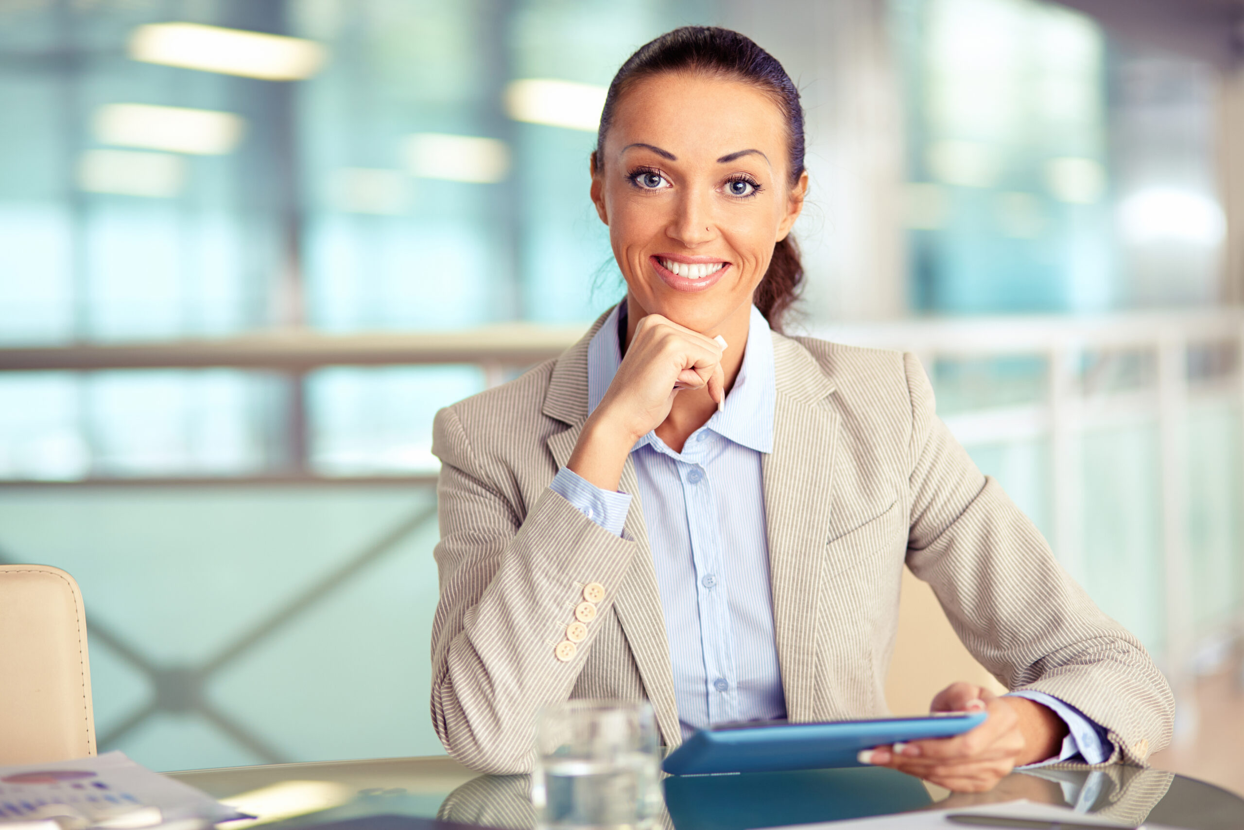 Portrait of confident employee with touchpad looking at camera